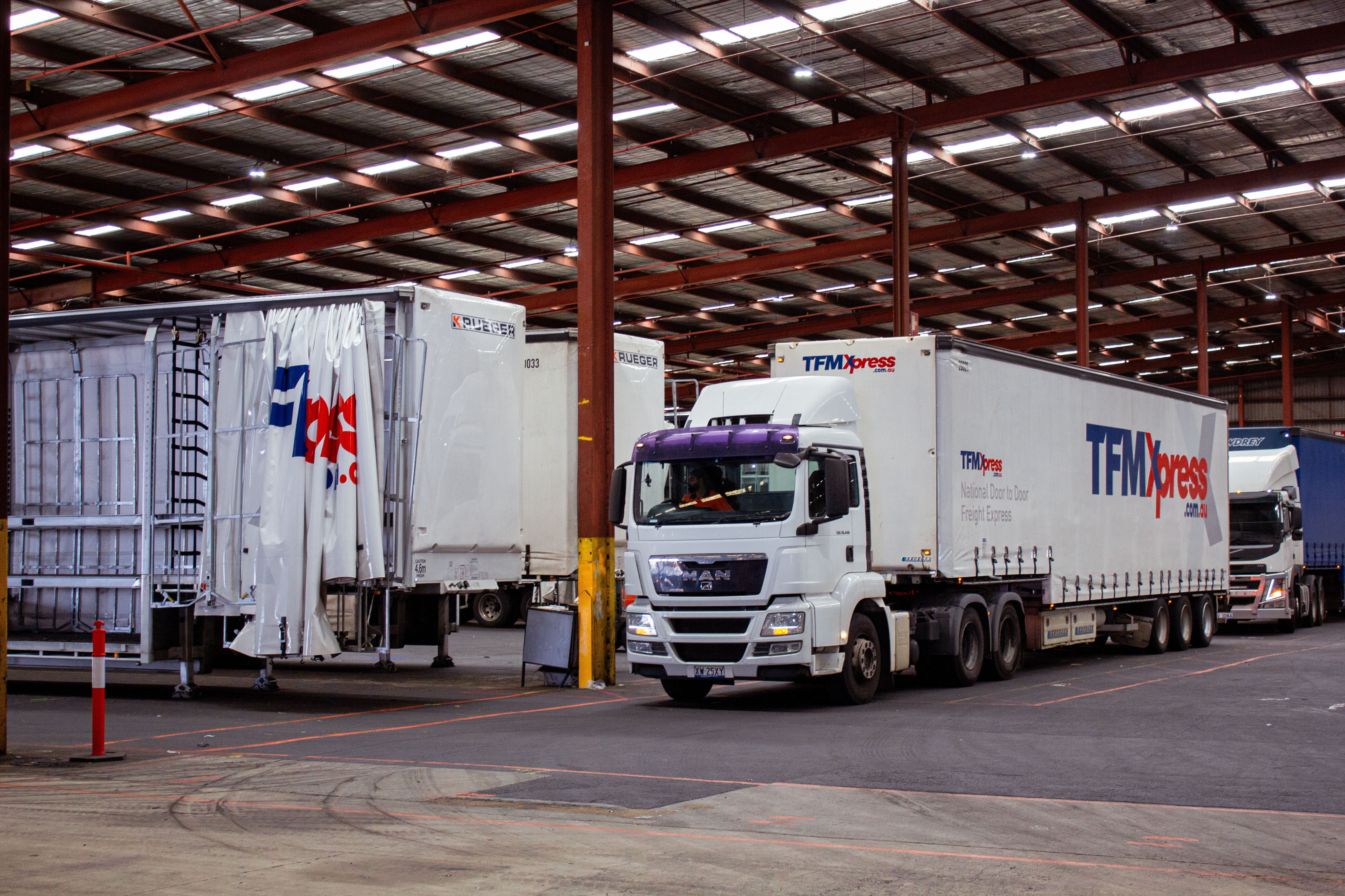 TFMXpress trucks in depot